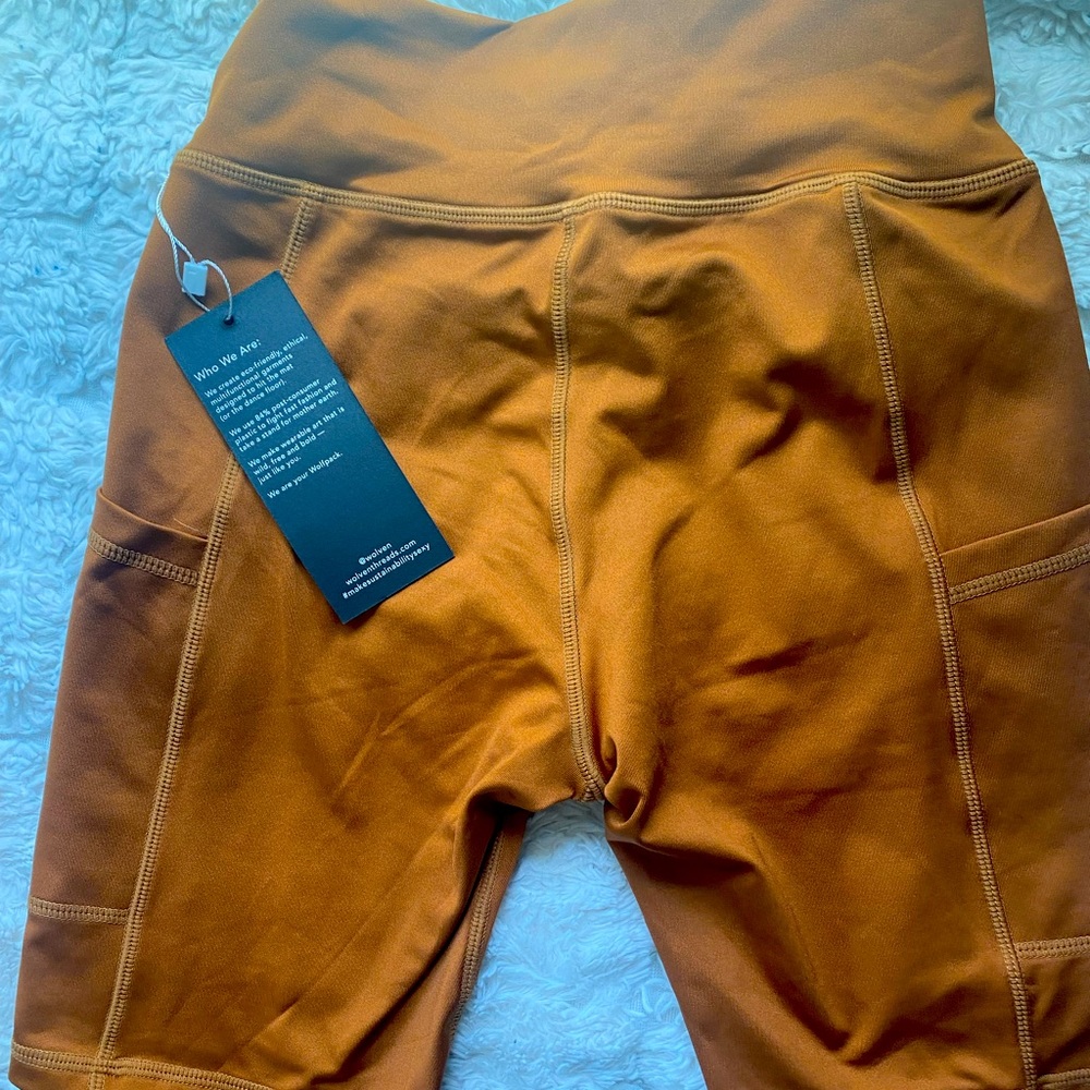 Wolven turmeric colored M biker shorts. NWT